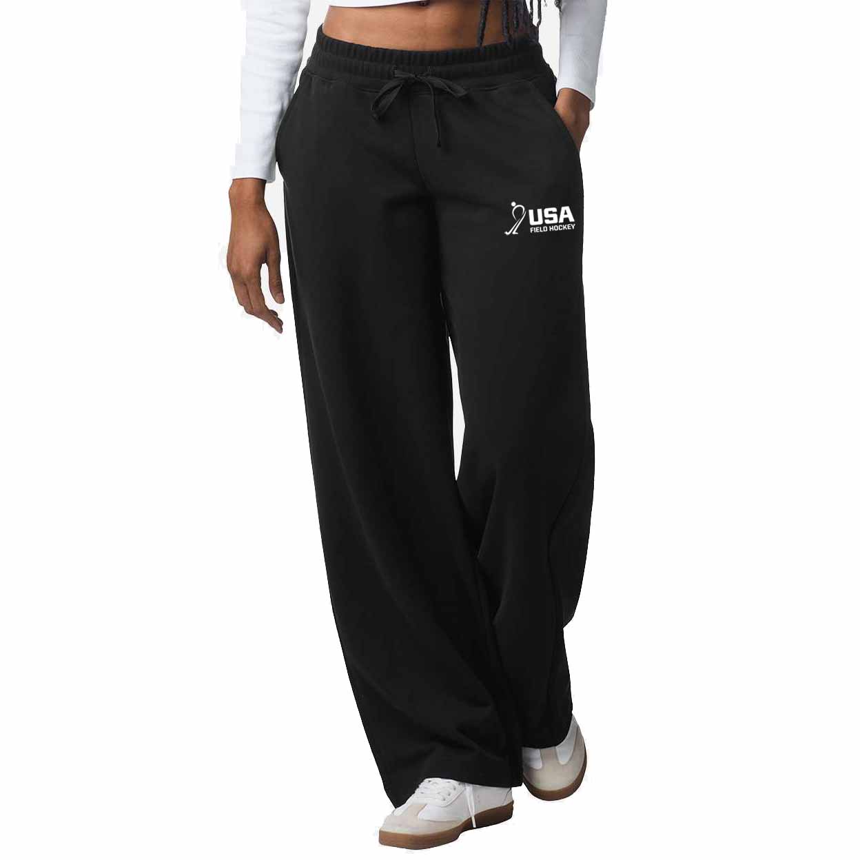 Black sweatpants with 'USA' logo worn by a person on a white background