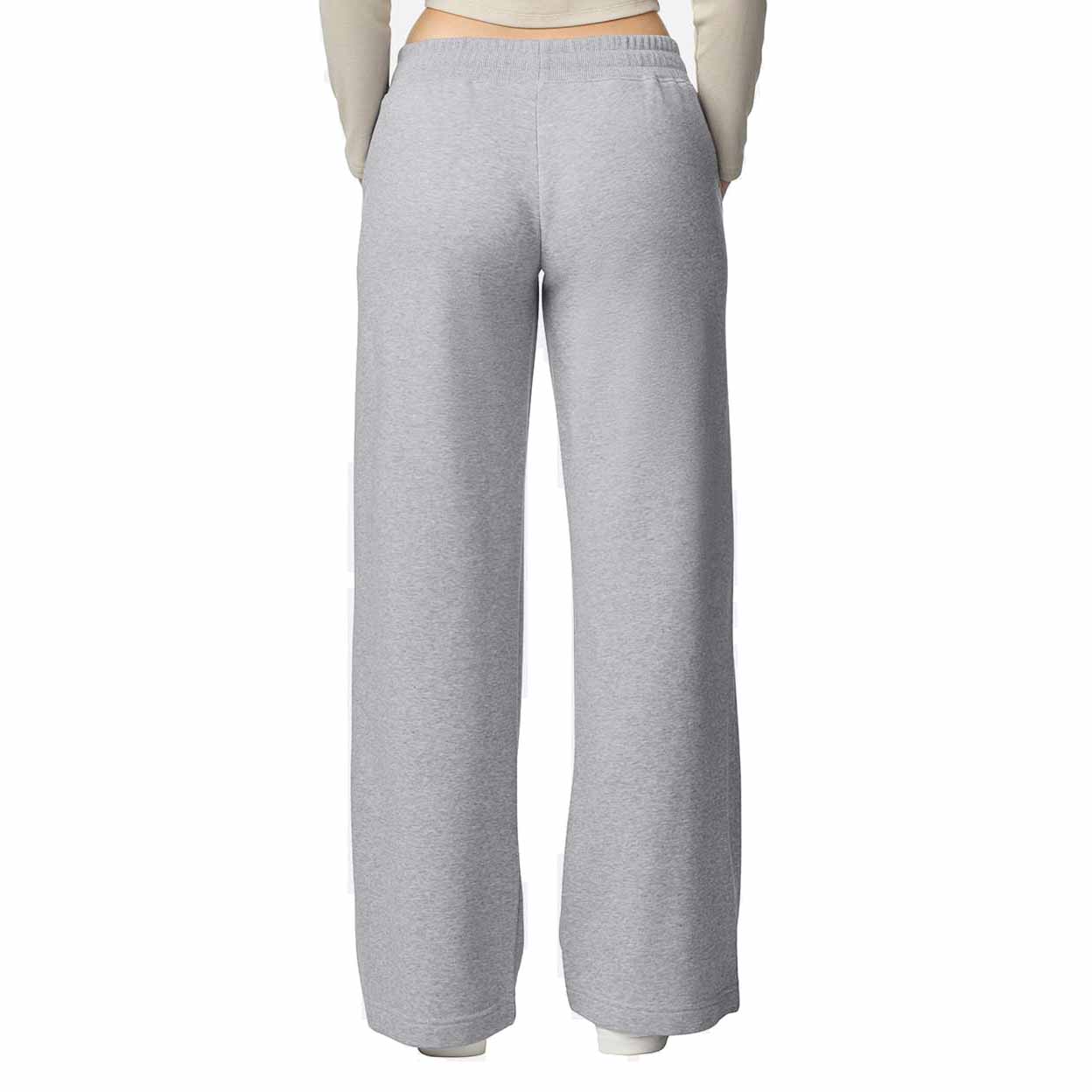 Gray sweatpants worn by a person on a white background