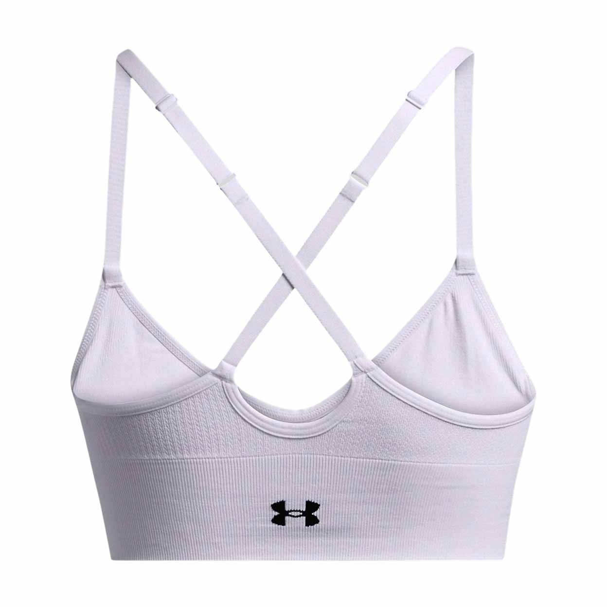 White sports bra with criss-cross straps on a white background