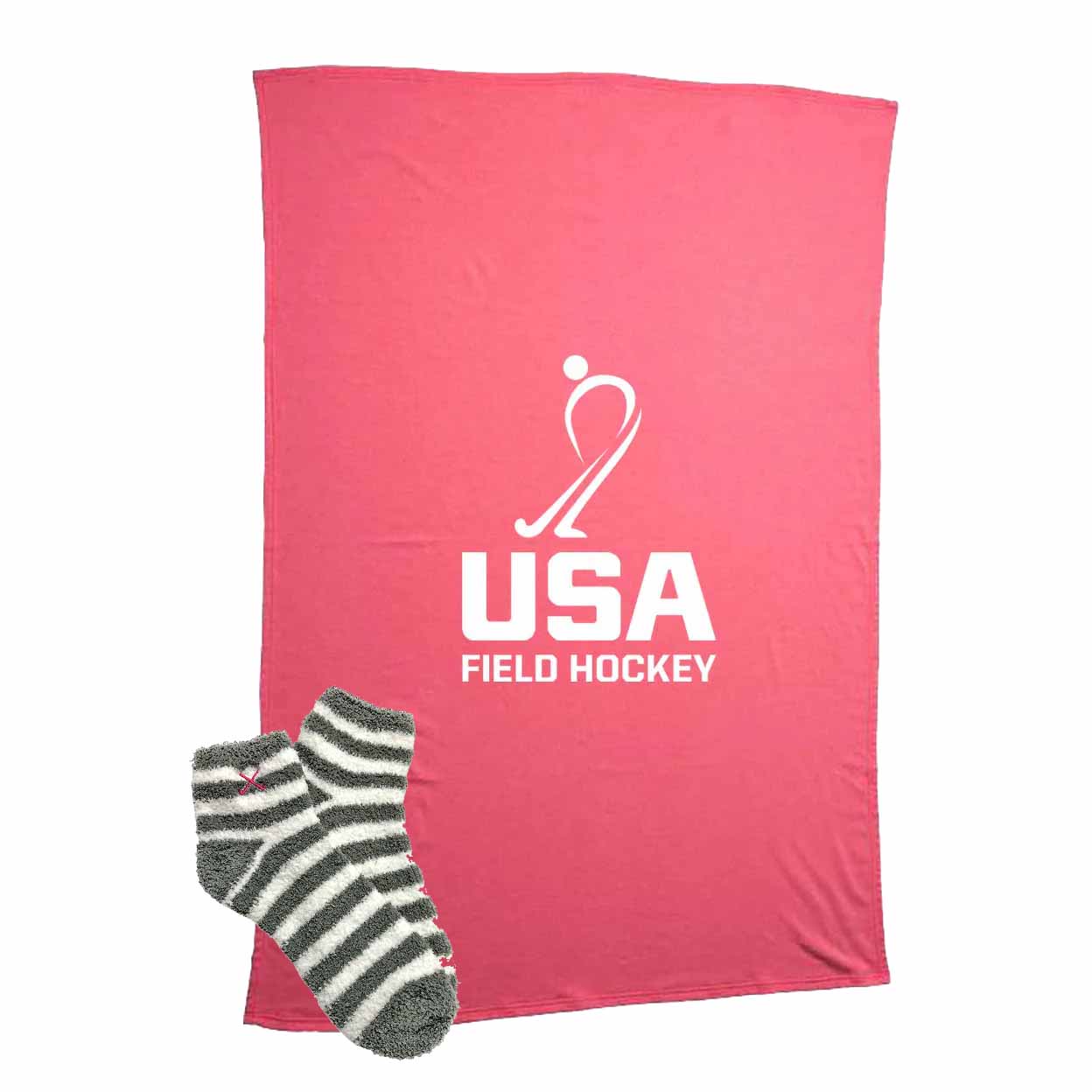 Pink blanket with USA Field Hockey logo and a pair of striped socks on a white background