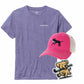 Purple t-shirt with field hockey design, pink cap with dog and stick design, and sticker with dog and stick design on a white background.