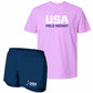 A two-piece athletic set featuring a light purple short-sleeve t-shirt with 'USA FIELD HOCKEY' printed in white and navy, paired with navy blue athletic shorts with a white USA Field Hockey logo.