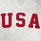 Detail of the USA on the front of the USA Field Hockey Tackle Twill Crewneck