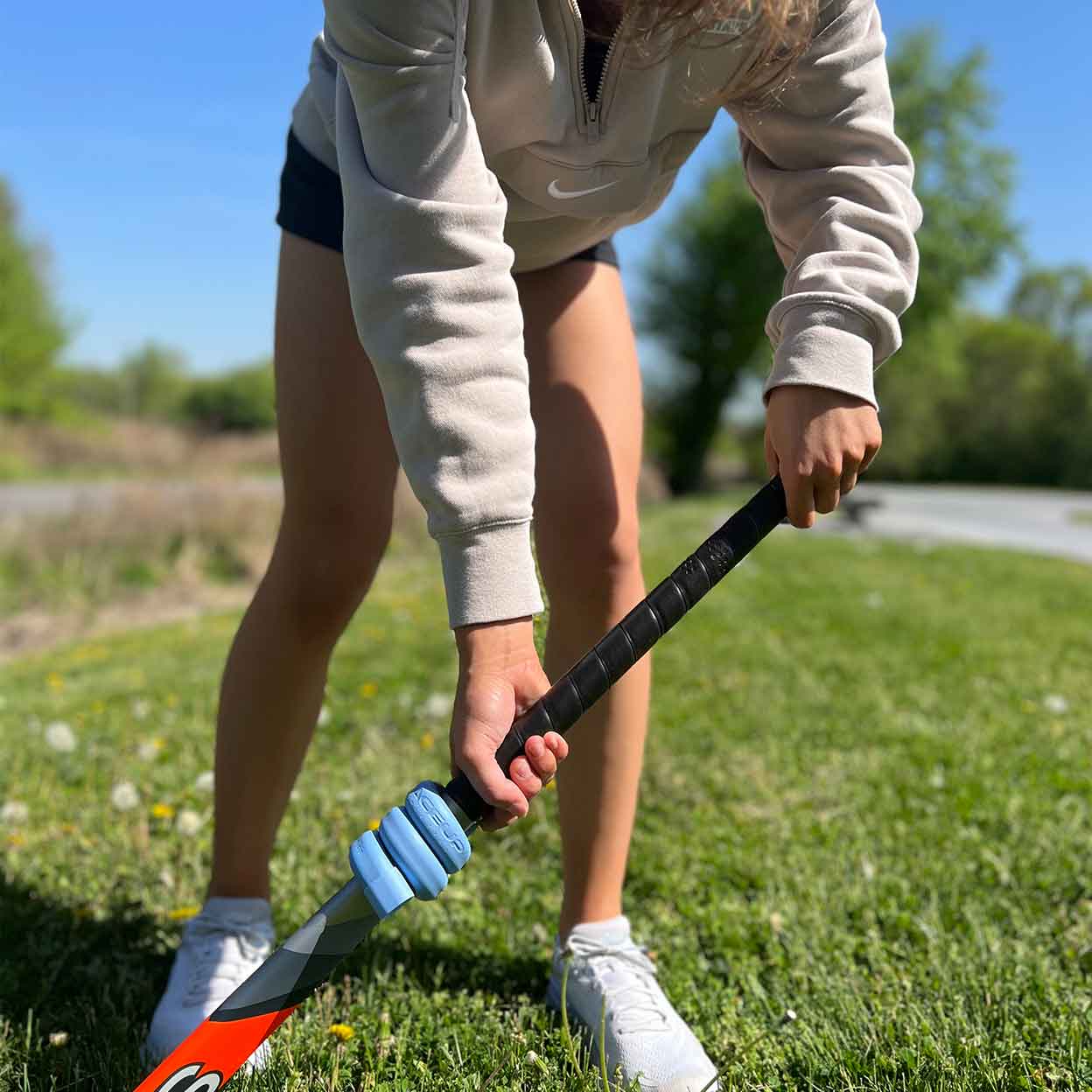 Player using the LaceUp 12 oz. Field Hockey Training Weight