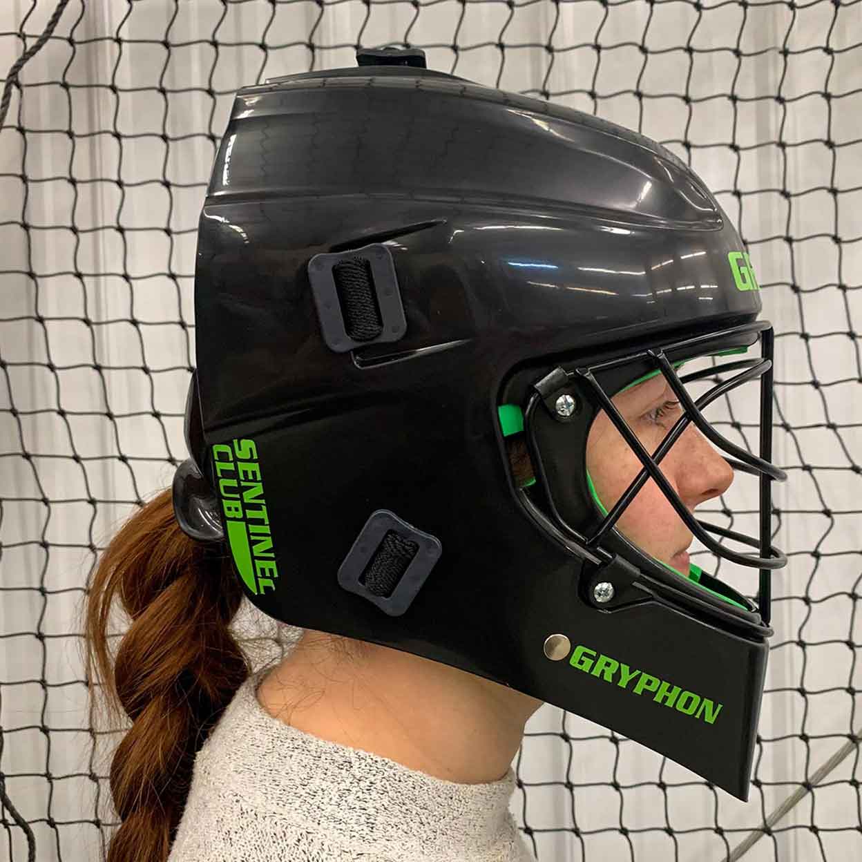 Side view of girl wearing the Gryphon Sentinel Goalkeeping Helmet