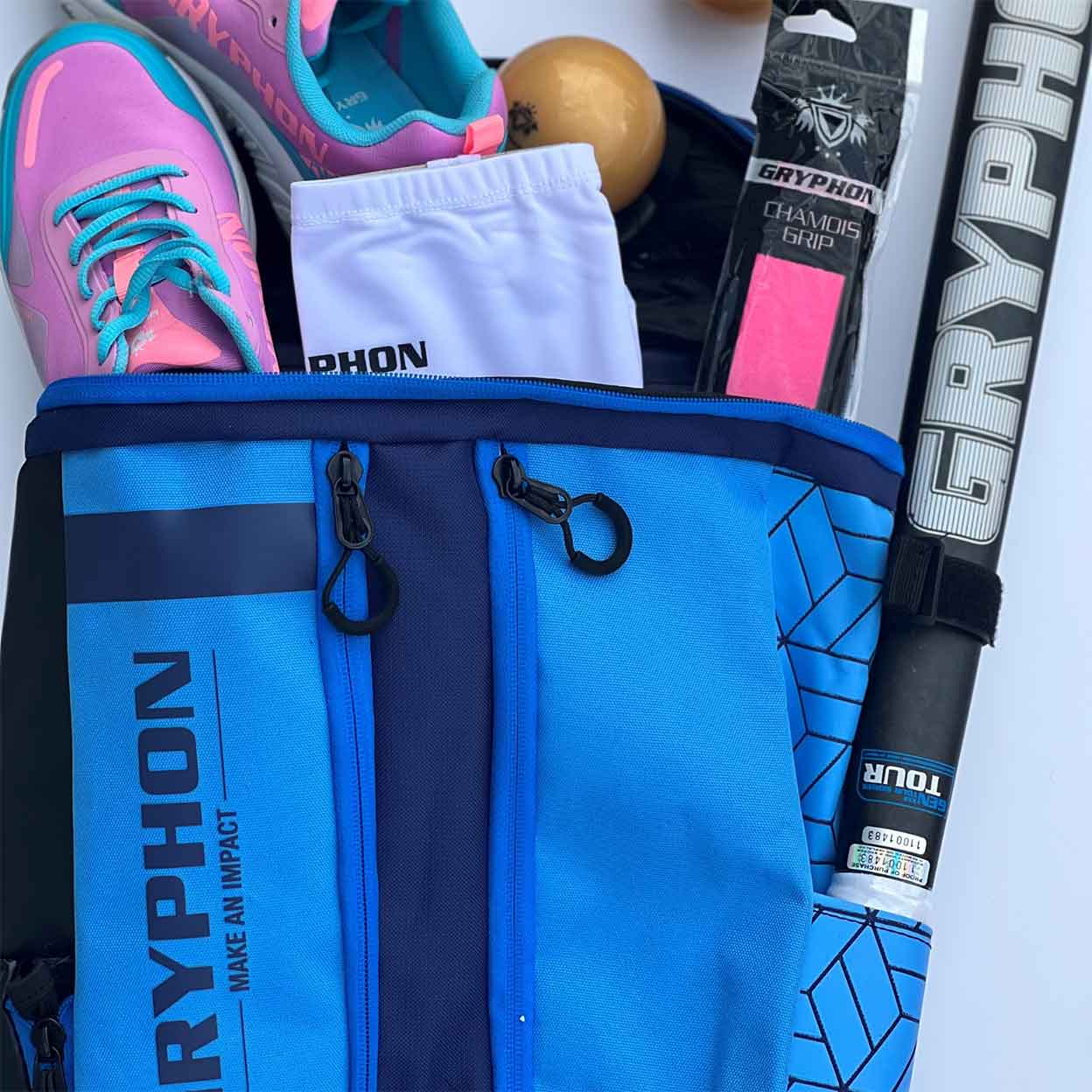 Gryphon Mini Freddie Backpack filled with Gryphon field hockey products.